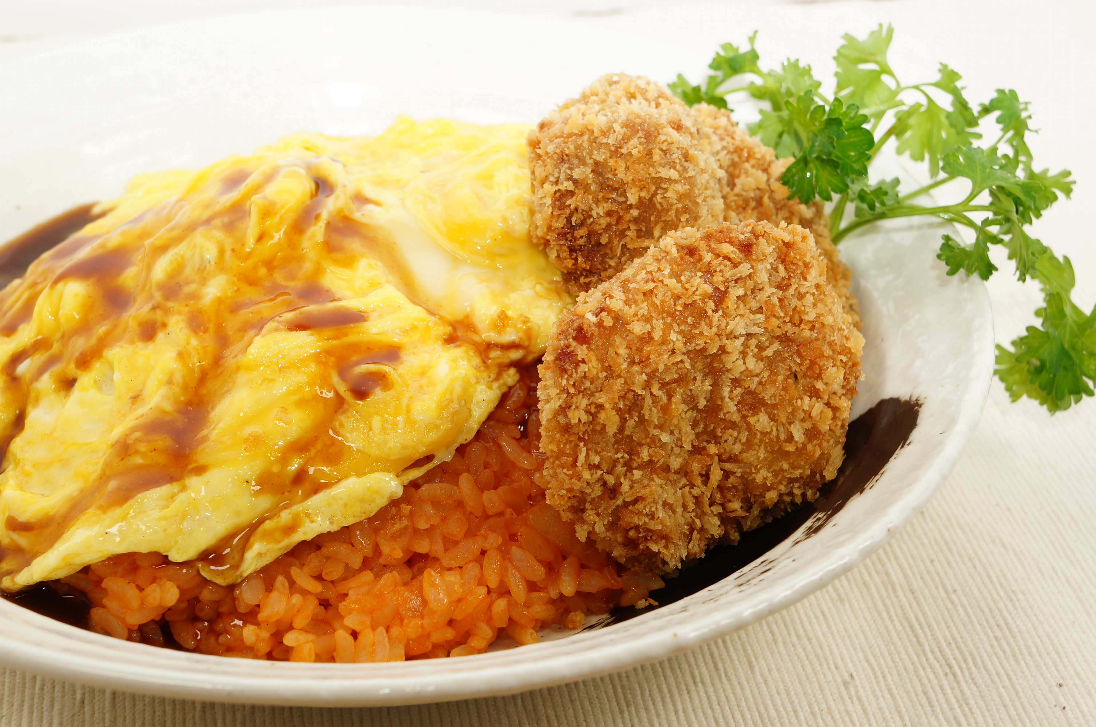 Photo of Omu-rice with fluffy egg on top and Hire-katsu